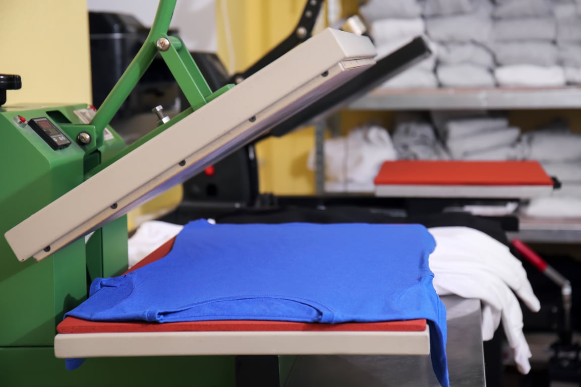 Modern Printing Machine with T-Shirt at Printing Shop